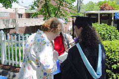 Leah, Mom & Grandma checking out diploma